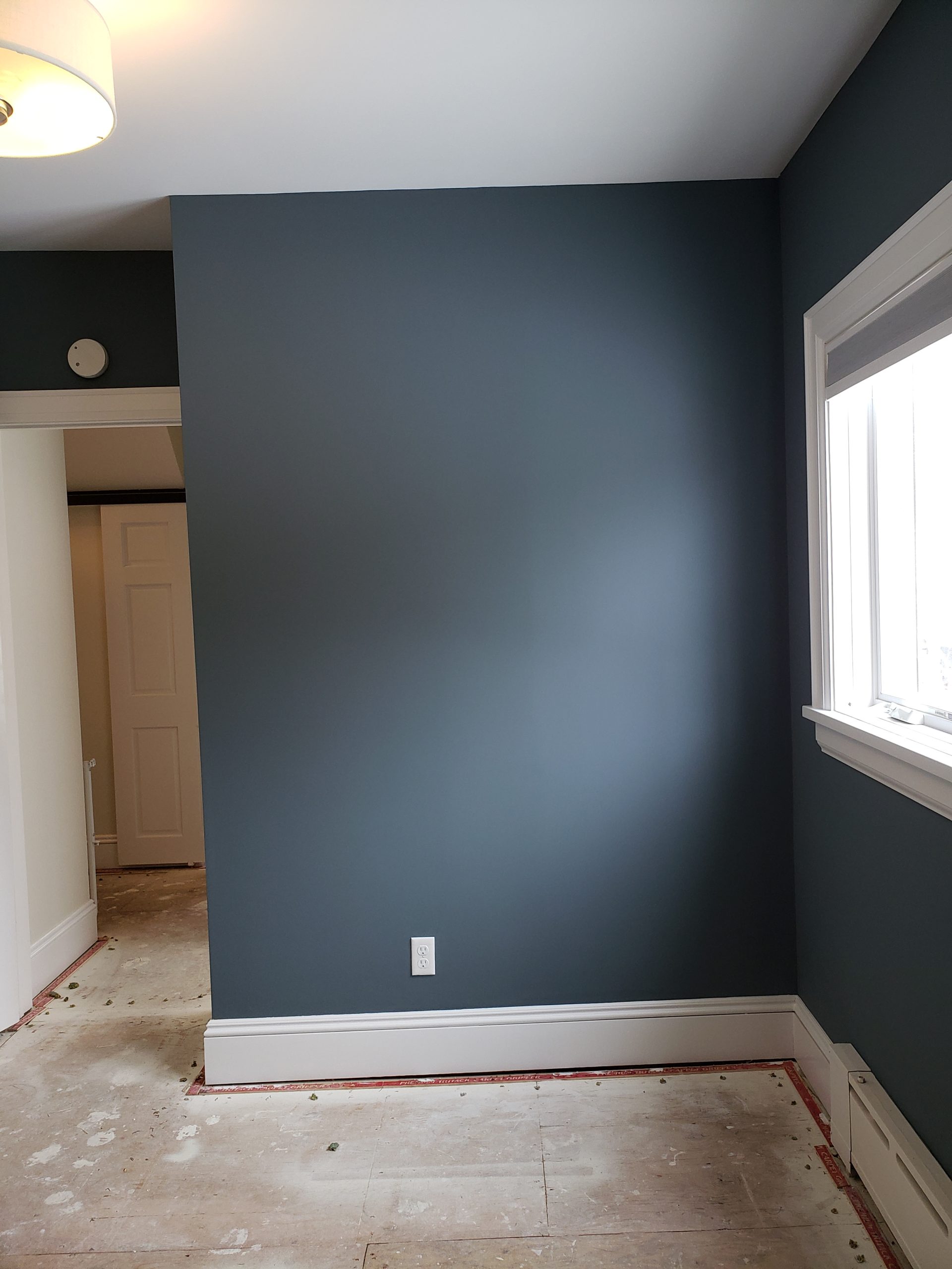 Interior wall before pipe leak restoration